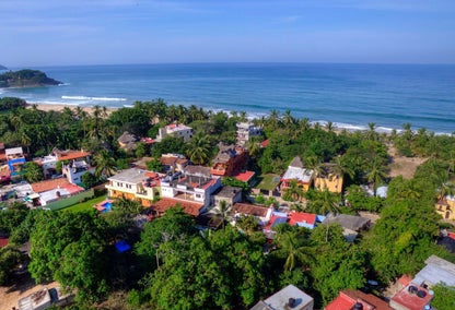 Aerial view of the ocean and San Pancho homes for sale
